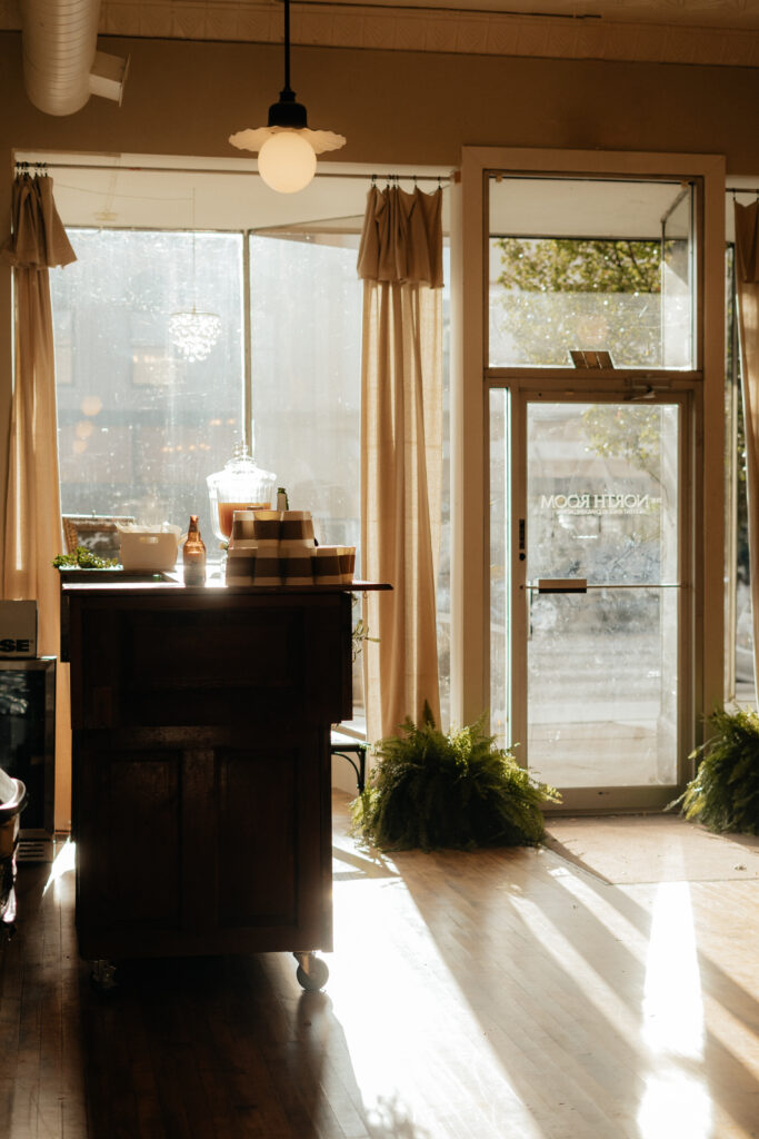 the evening light illuminates a coffee bar at the venue