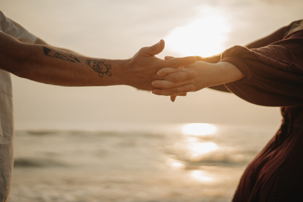 a couple holding hands at their elopement