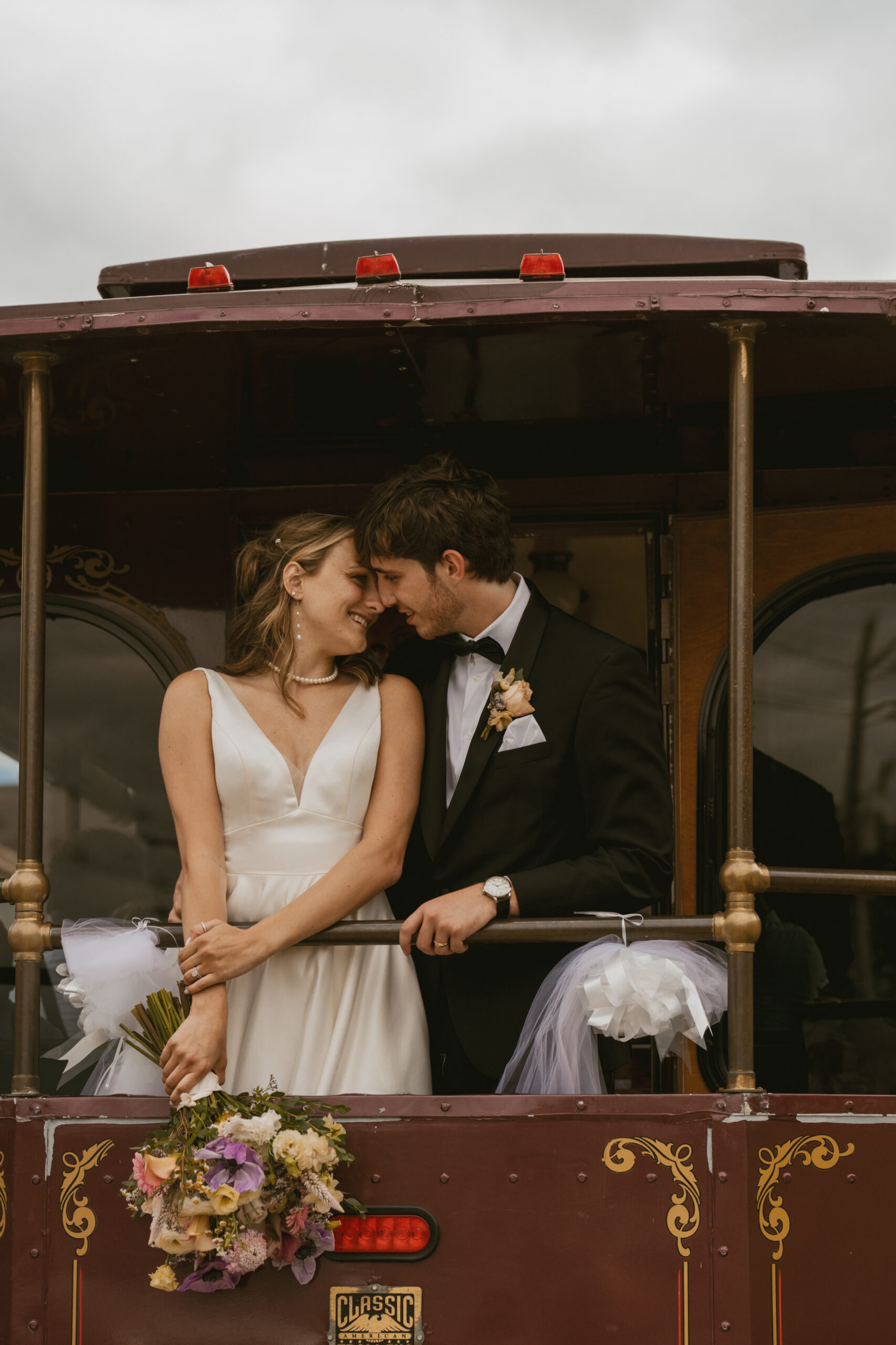 Bride and Groom embrace on the Trolley