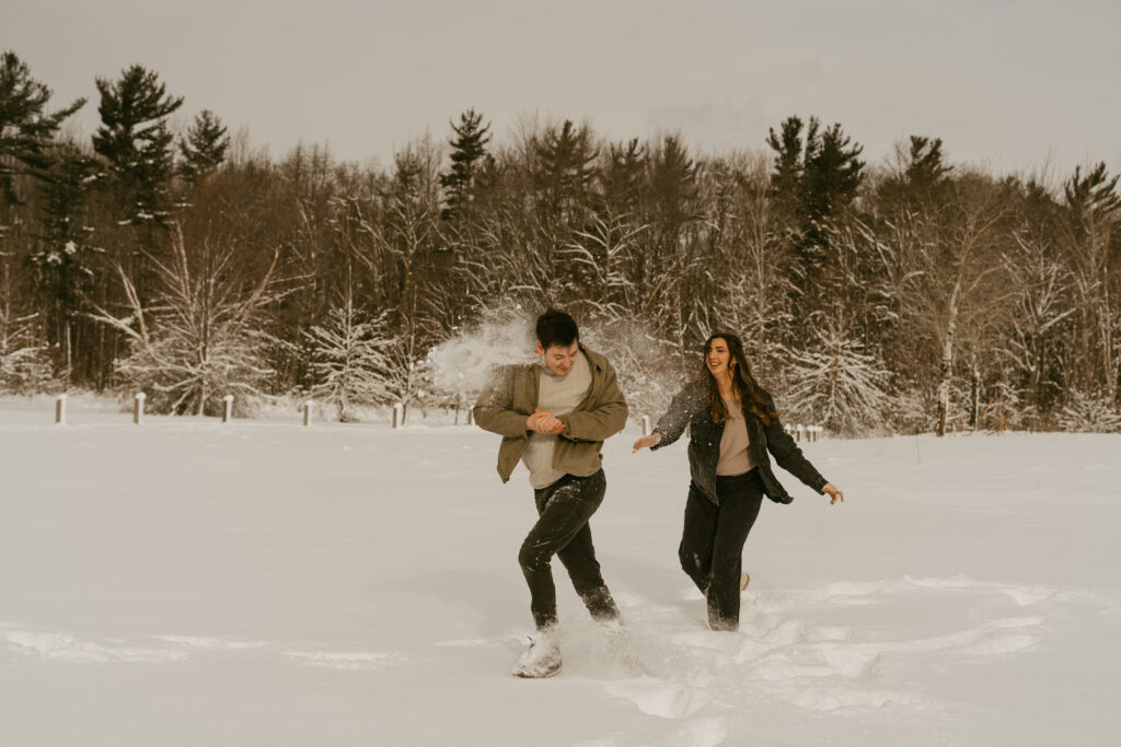 couple has snow ball fight 