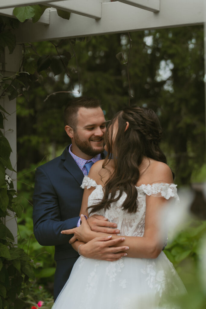 A couple embraces on their wedding day