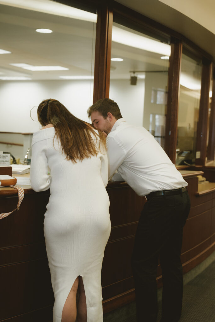 Hudsonville courthouse elopement - couple exchanging vows with a backdrop of charm