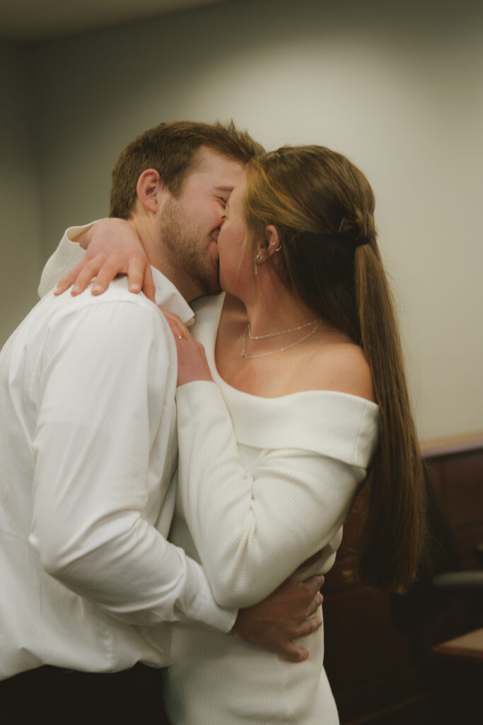 Couple embraces outside of the courthouse