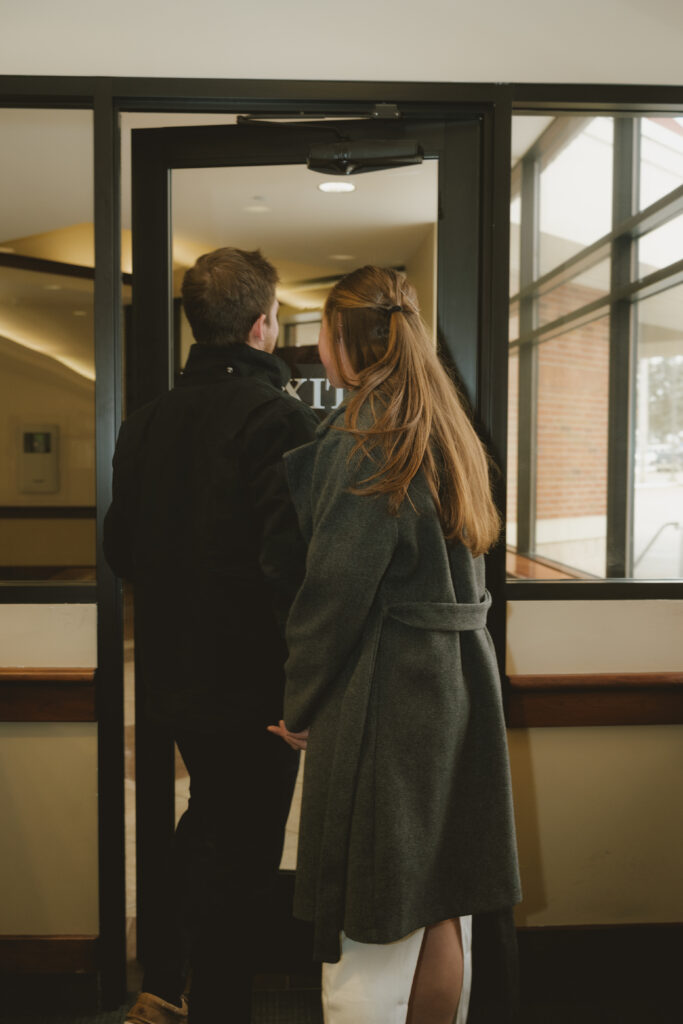 Couple embraces outside of the courthouse: West Michigan Wedding Photo