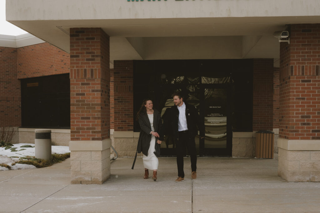 Hudsonville courthouse elopement - couple exchanging vows with a backdrop of charm