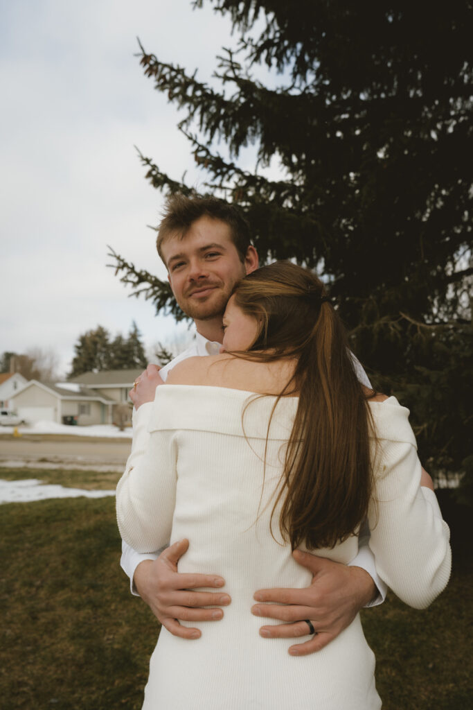 West Michigan Wedding Elopement: Couple embraces outside of the courthouse