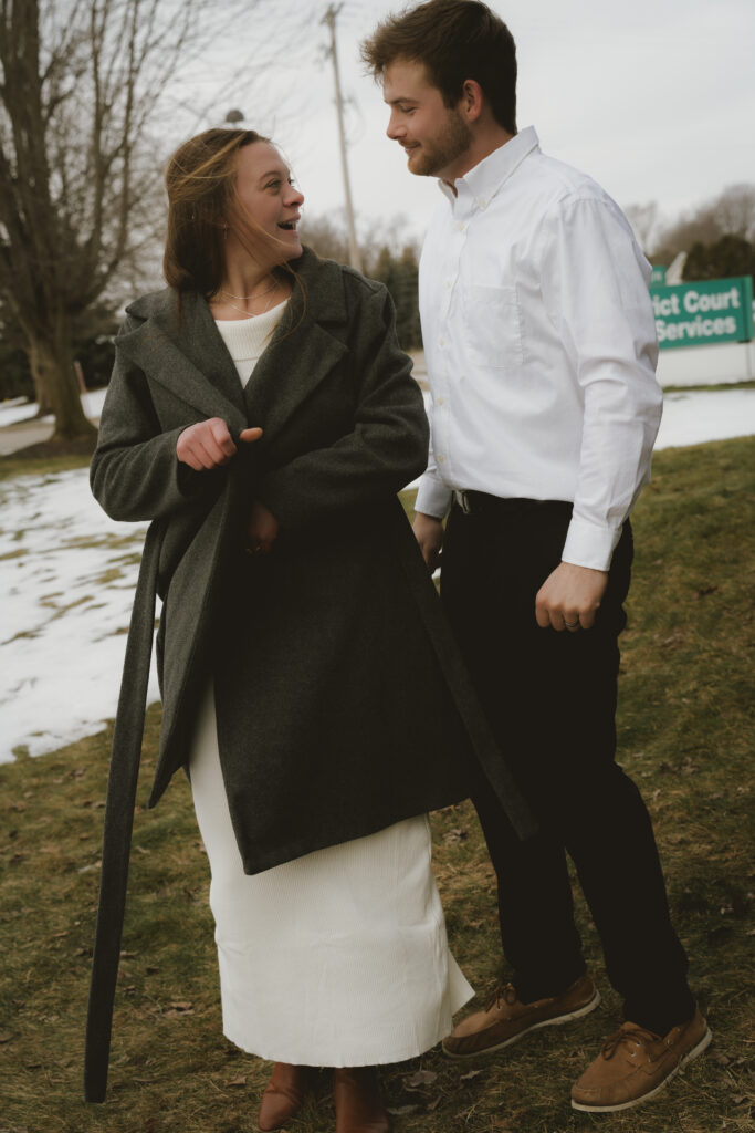 Couple embraces outside of the courthouse