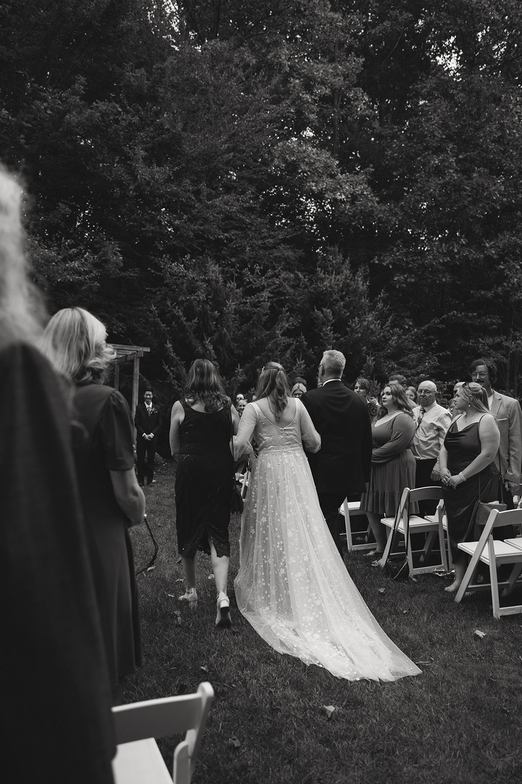 groom enters her micro wedding with her mom and dad!