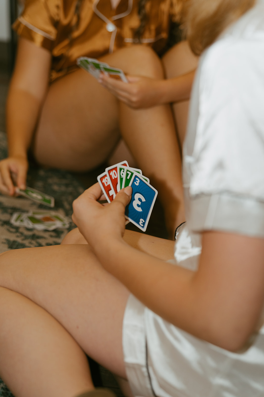 bridal party plays uno as they prepare for the beautiful day!