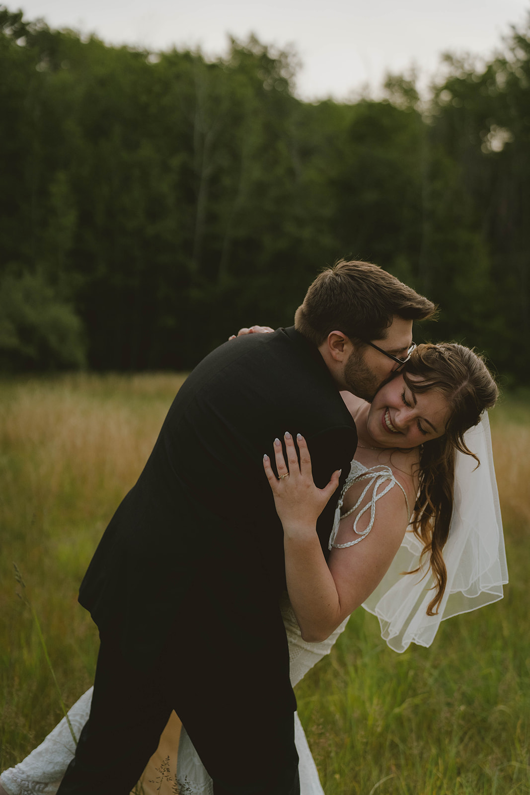 bride and groom share intimate moments after their beautiful backyard wedding ceremony