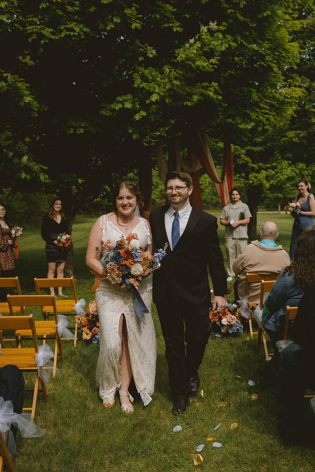 new husband and wife leave their backyard wedding ceremony 