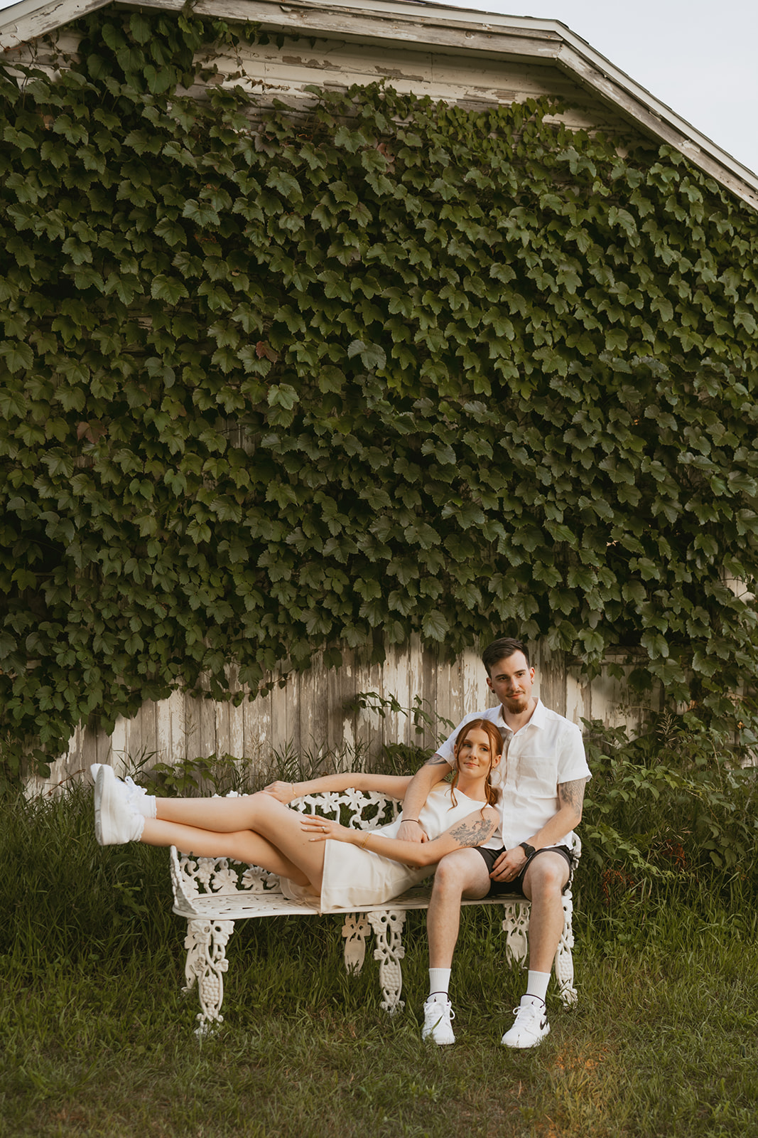 bride and groom pose together during their backyard adventure photoshoot 