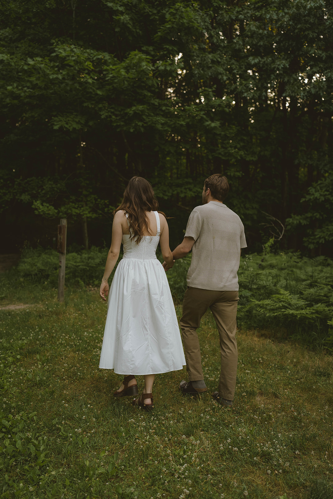 documentary style photo from a beautiful engagement photo shoot in a Grand Rapids park