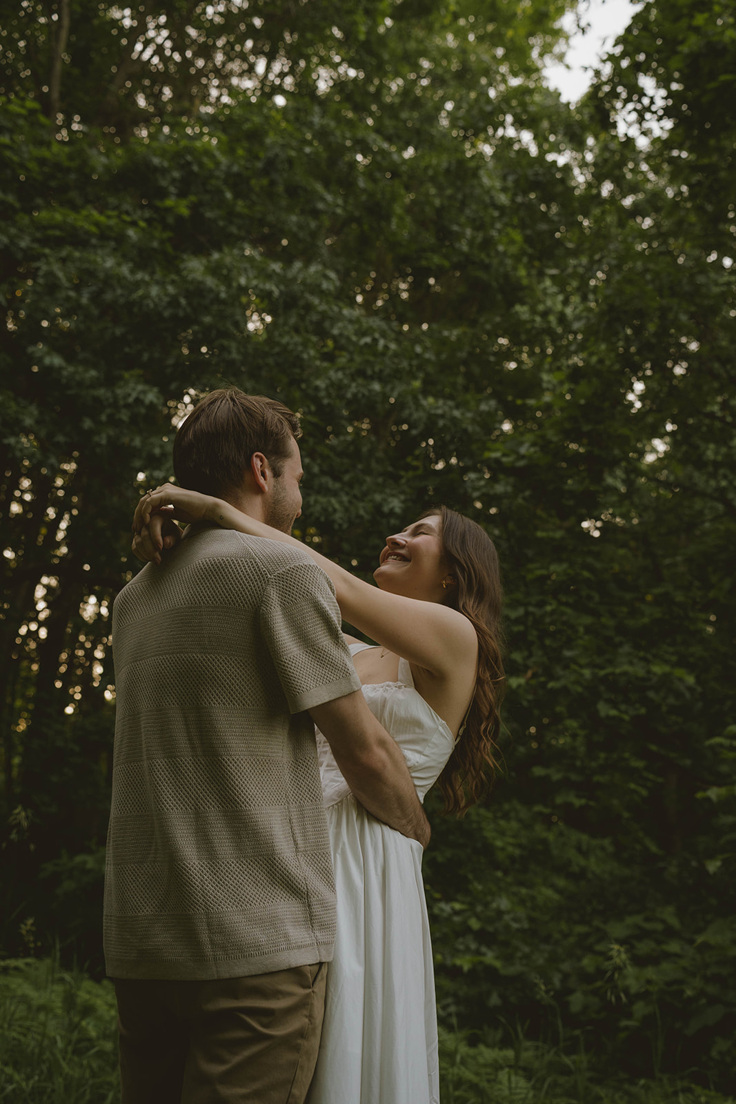 documentary style photo from a beautiful engagement photo shoot in a Grand Rapids park