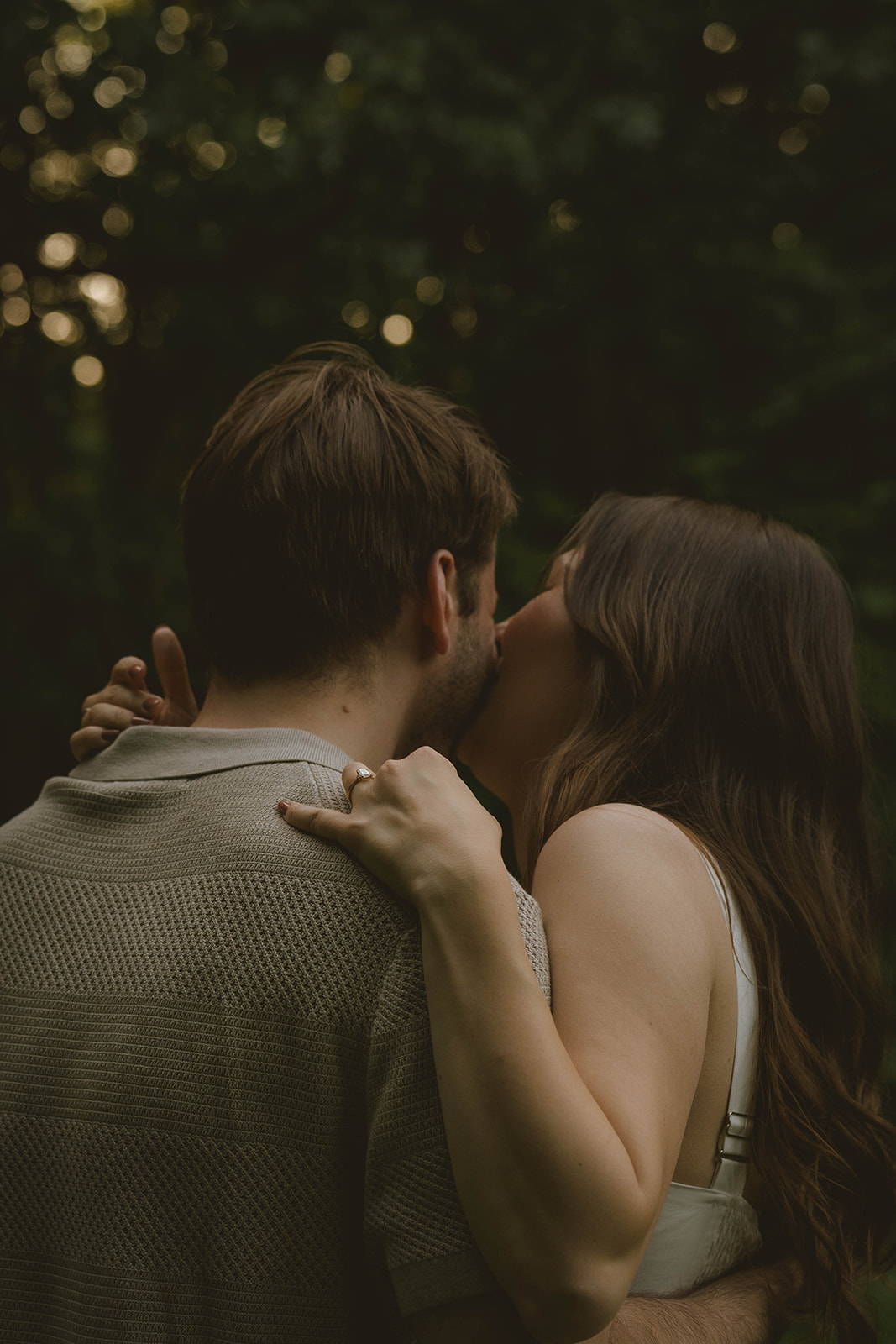 stunning couple dance in the park and take candid photos during their Grand Rapids engagement photo session