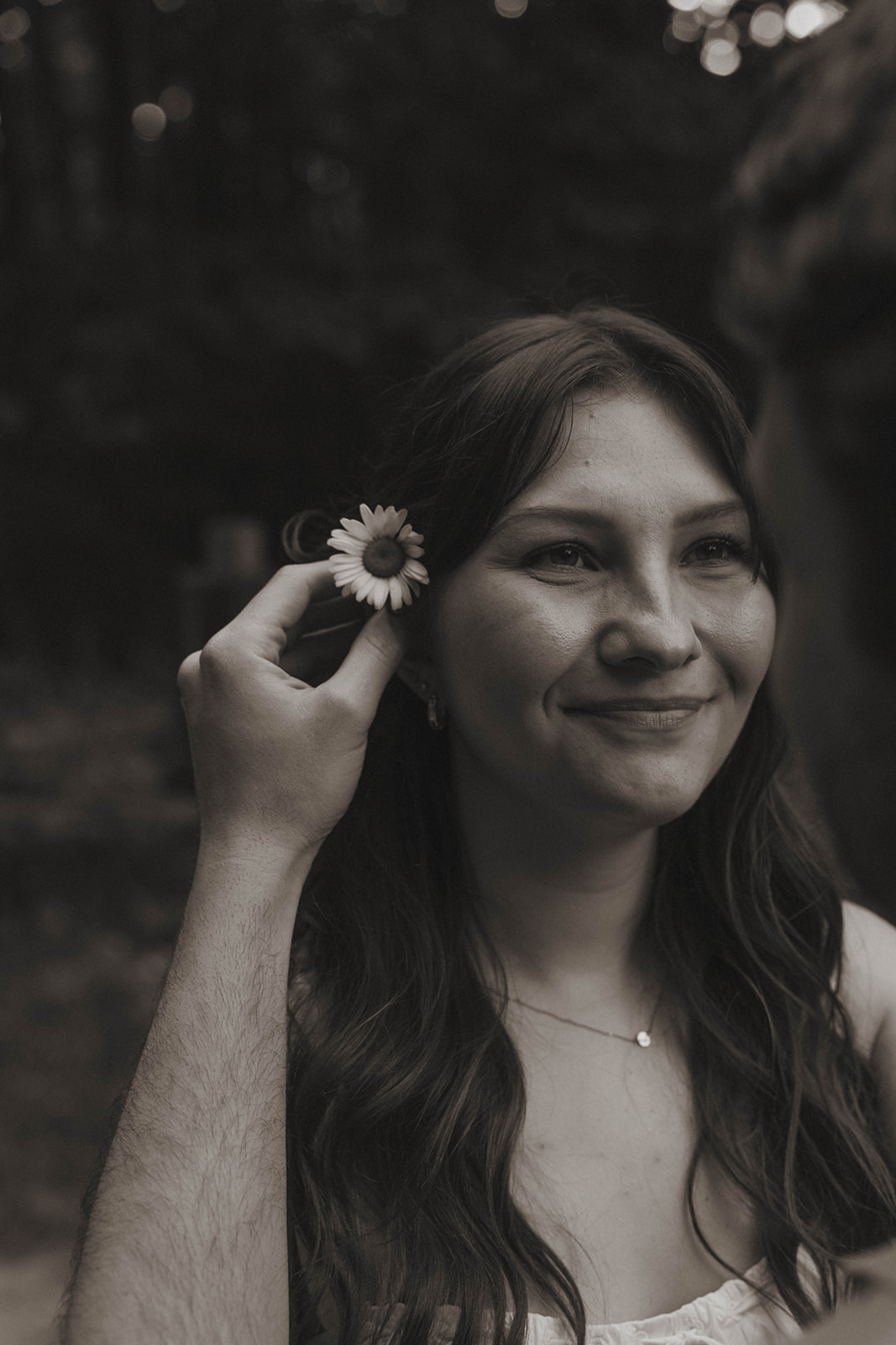 documentary style photo from a beautiful engagement photo shoot in a Grand Rapids park