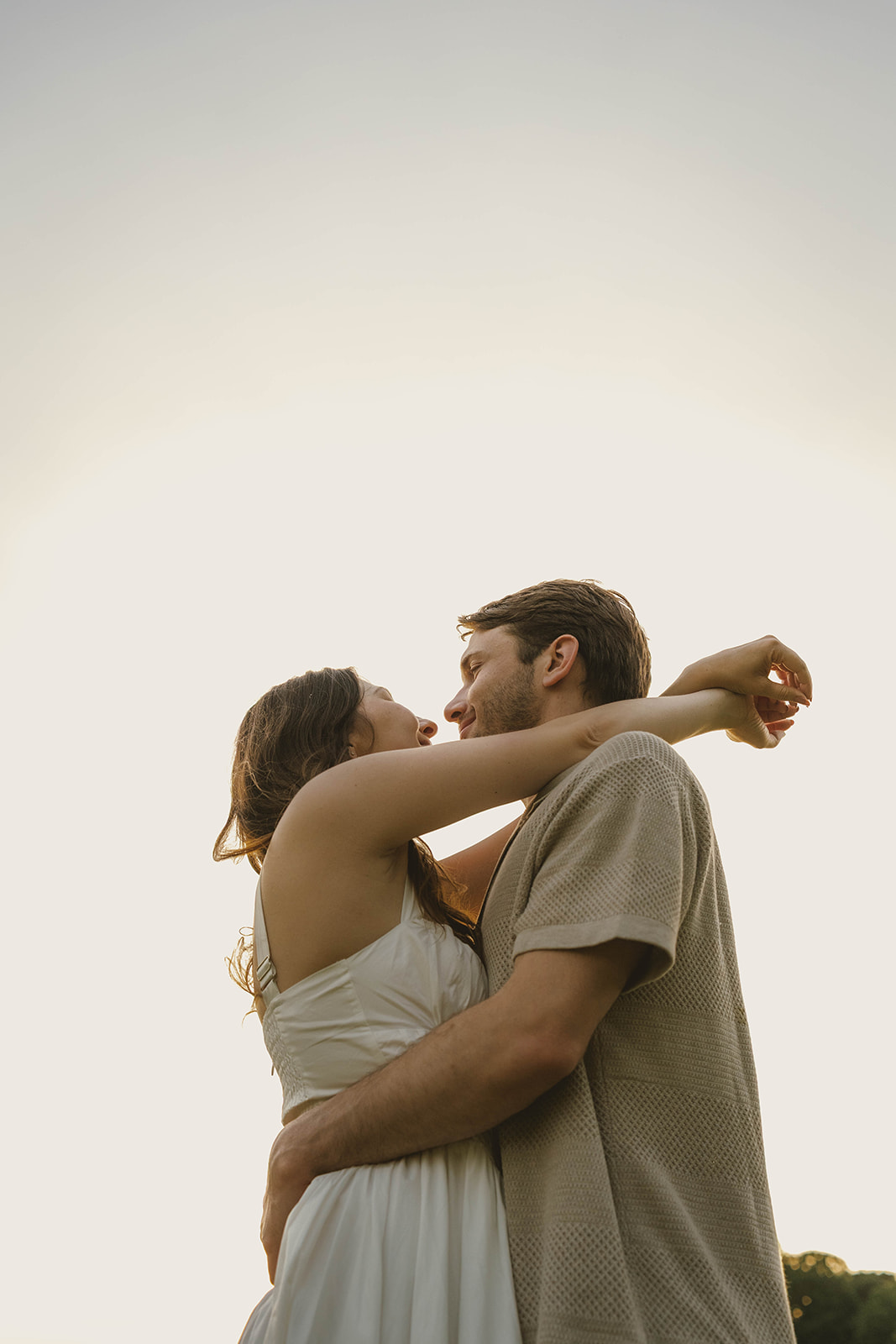 romantic engagement photos during a golden hour session in Michigan