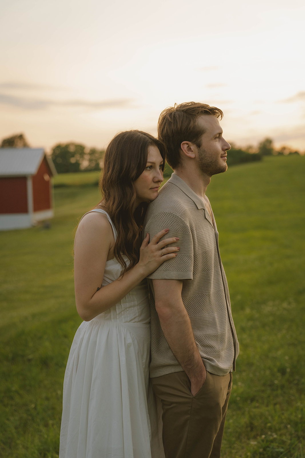 couple take intimate moments together during golden hour in the stunning Michigan field