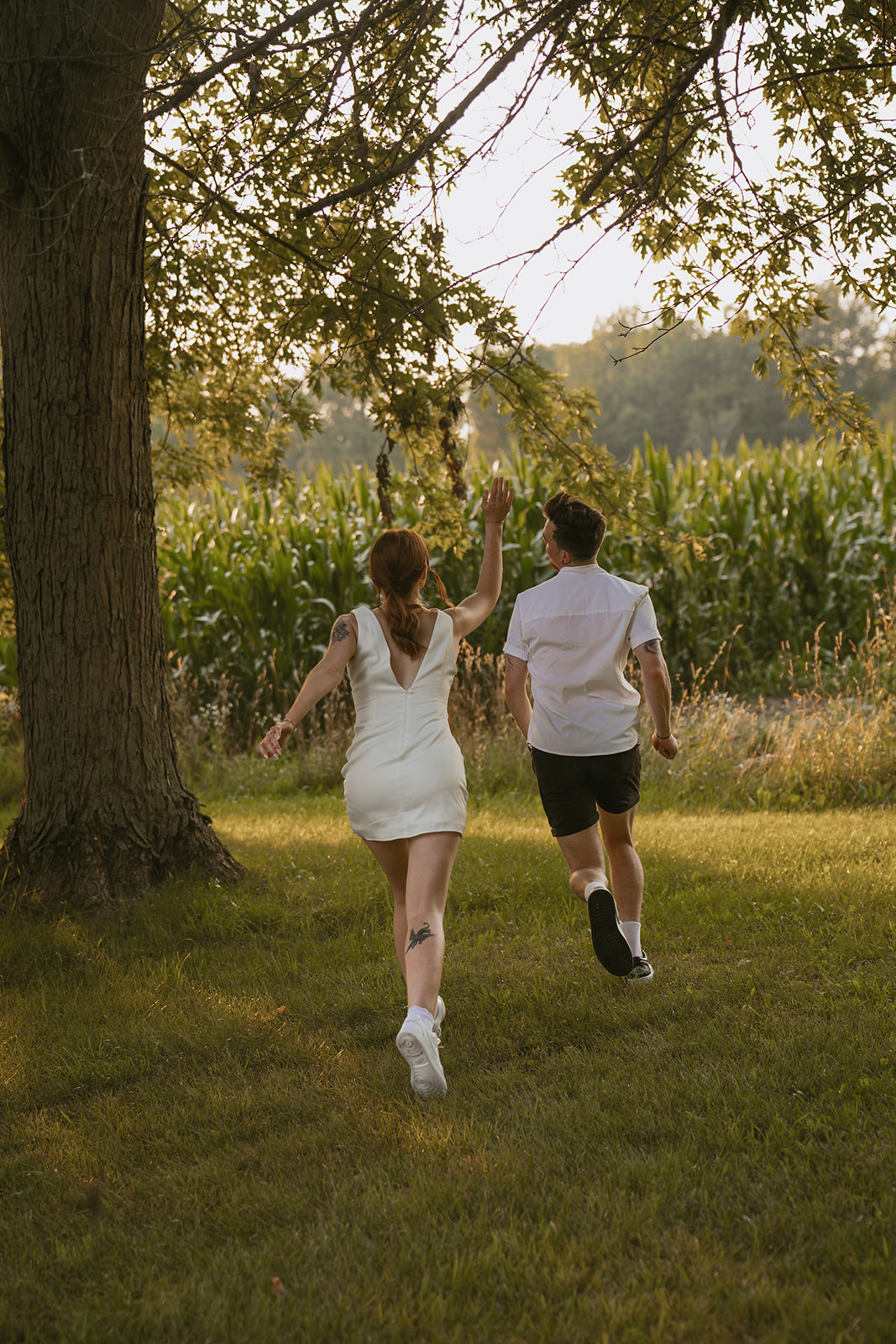 bride and groom pose together during their backyard adventure photoshoot 