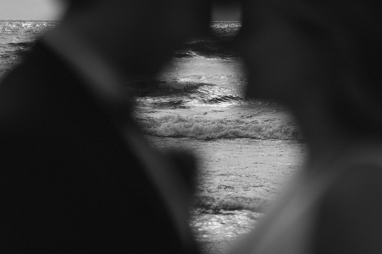 bride and groom share an intimate moment while Gabrielle Cynthia captures the lake between the bride and groom