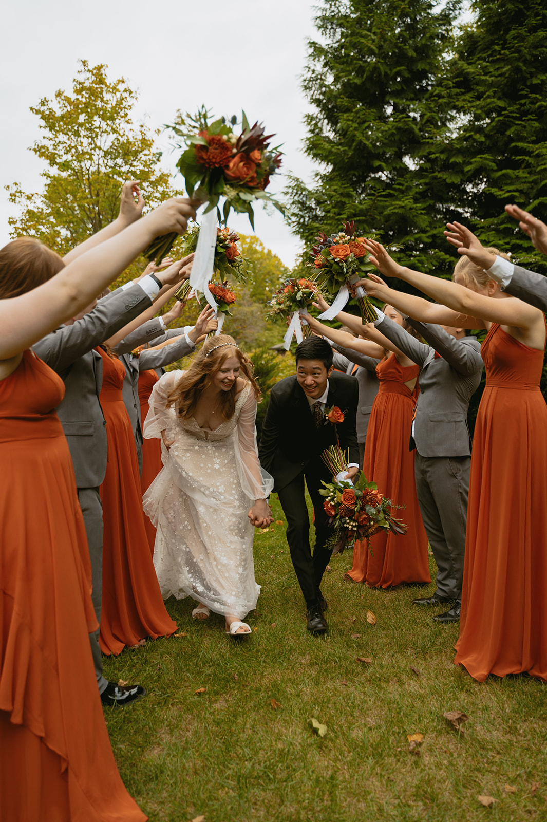 bride and groom exit their fall wedding right on time!
