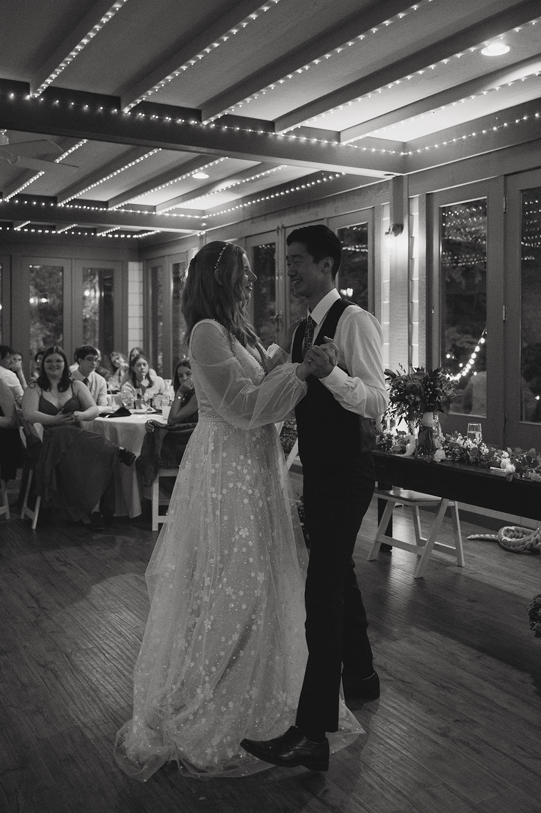 bride and groom share their dance together as a married couple, schedule first dance time in your wedding timeline!