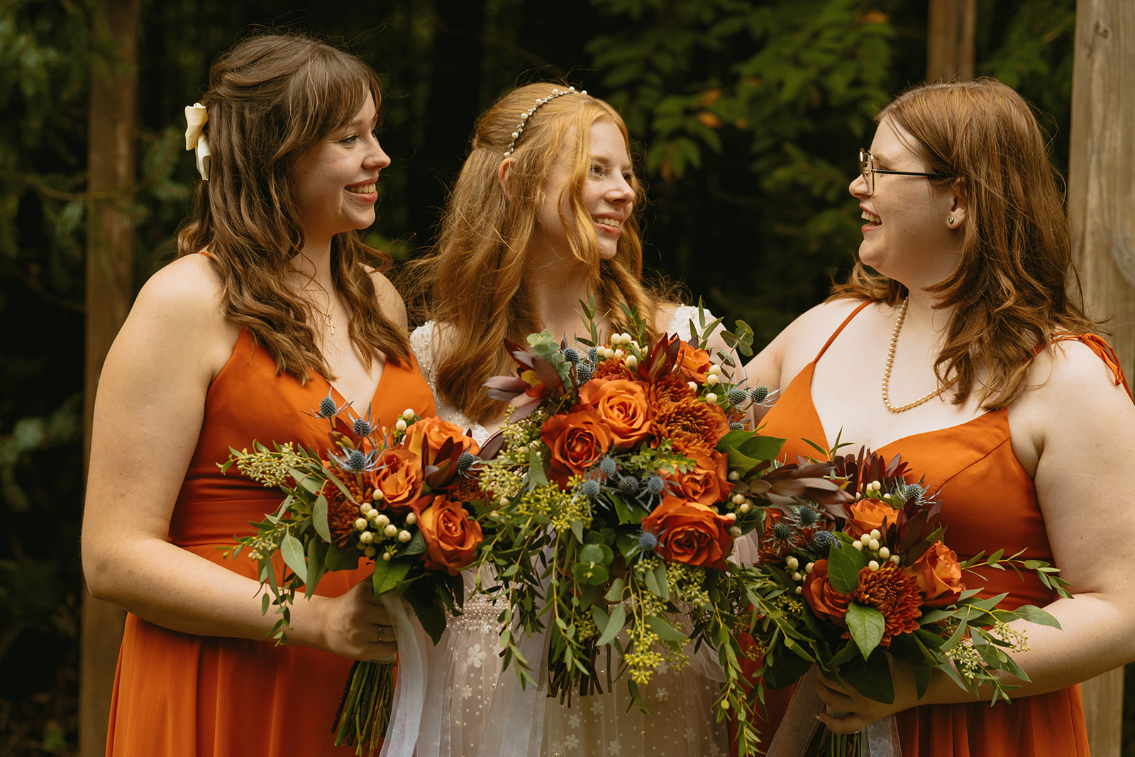 bride poses with her bridesmaids