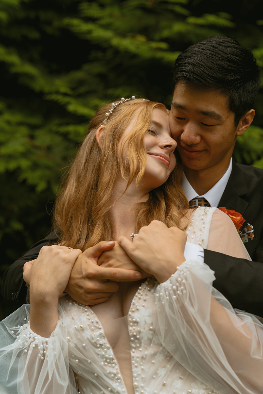 stunning bride and groom pose in the forest together during their fall wedding!