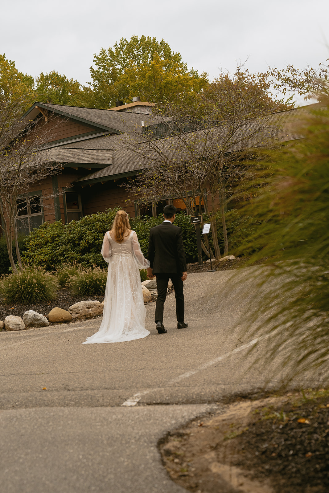 beautiful bride and groom enter their stunning Fall wedding day!