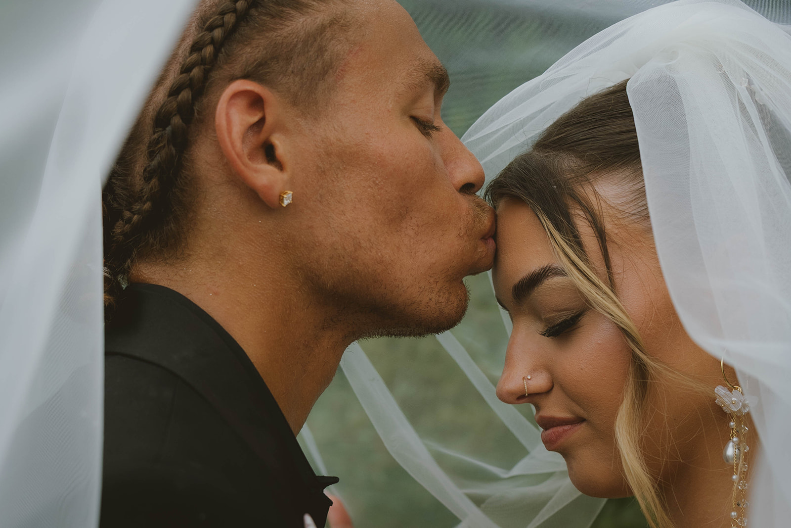 beautiful bride and groom share intimate moments during their outdoor wedding