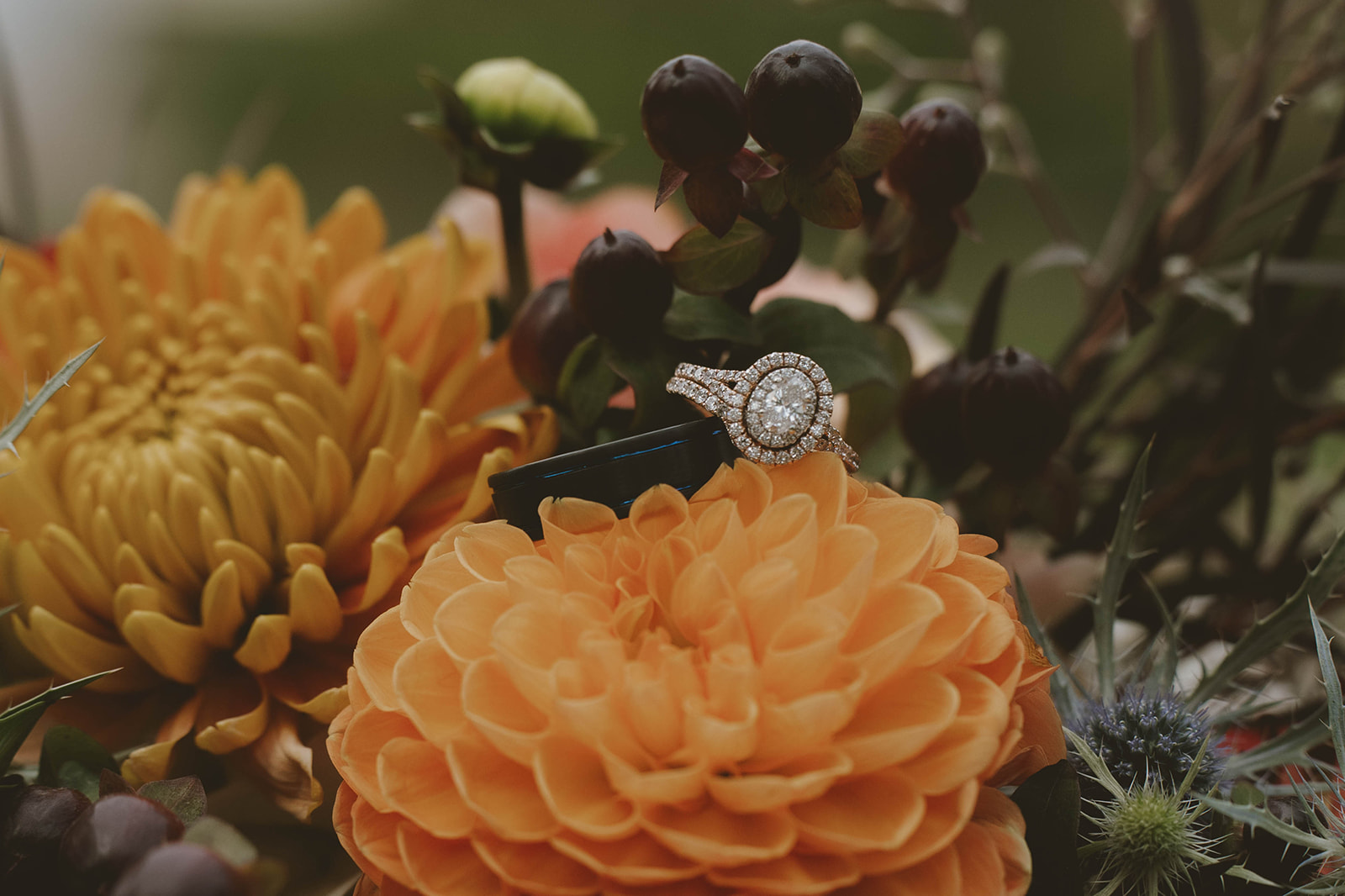 wedding rings sit on the flowers a perfect detail photo