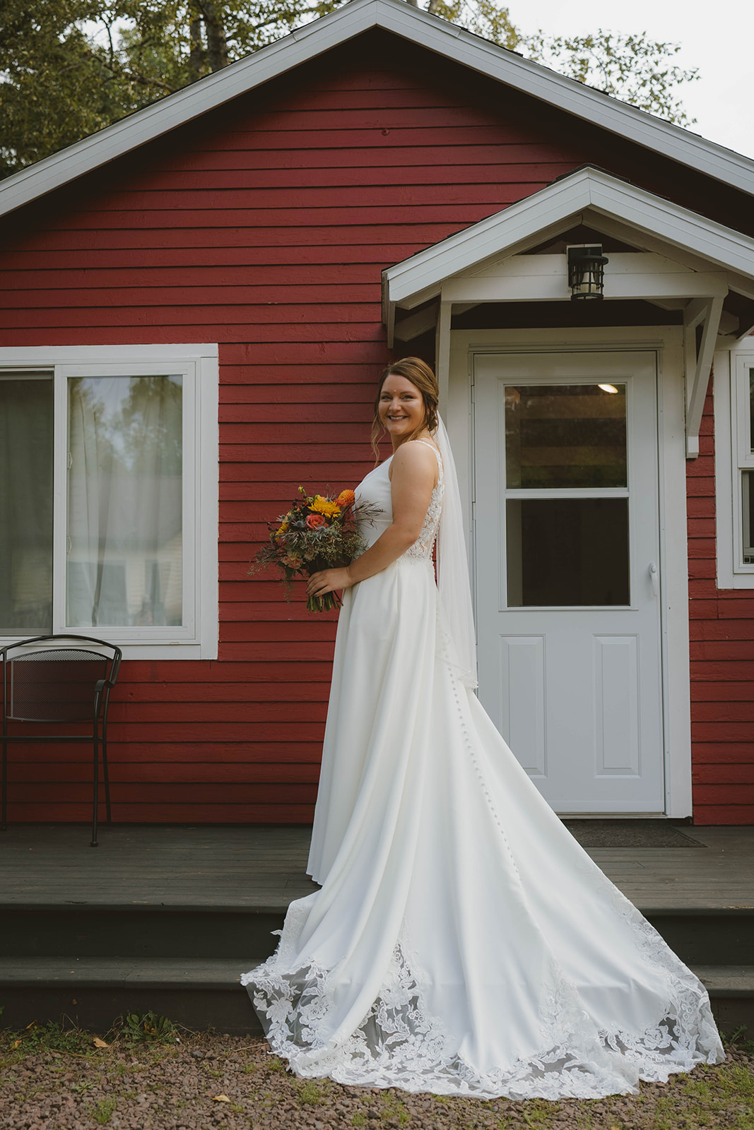 bride poses where her dress once hang