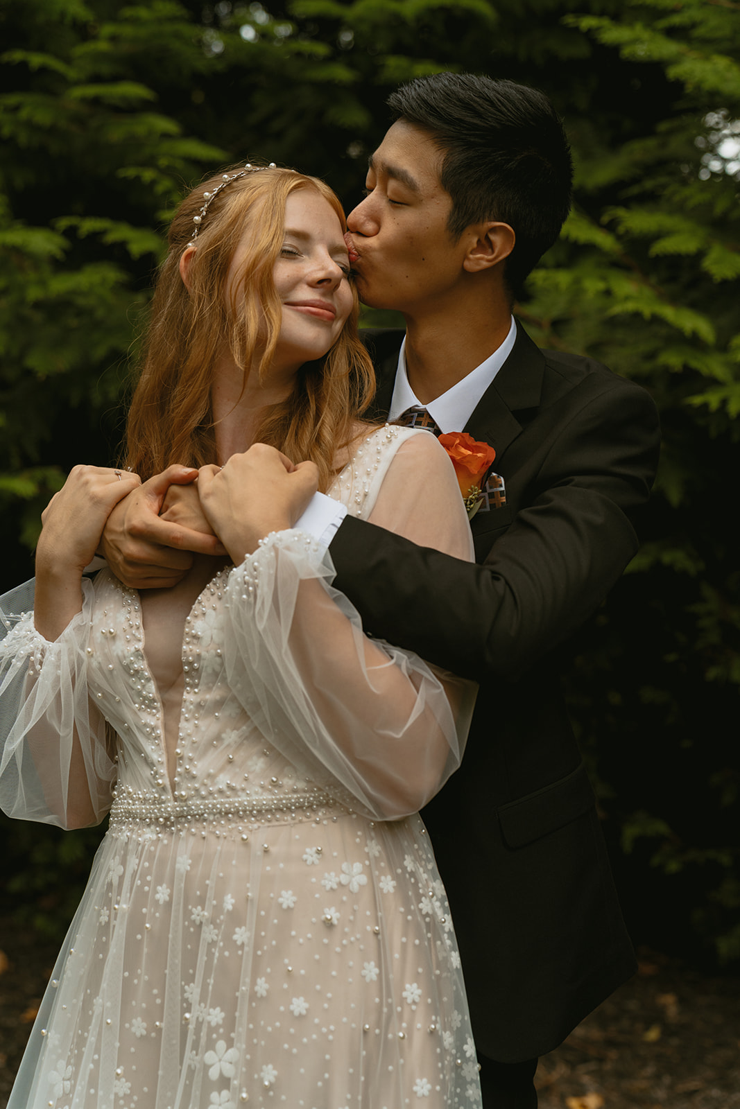 bride and groom share an intimate moment during their Michigan winter elopement