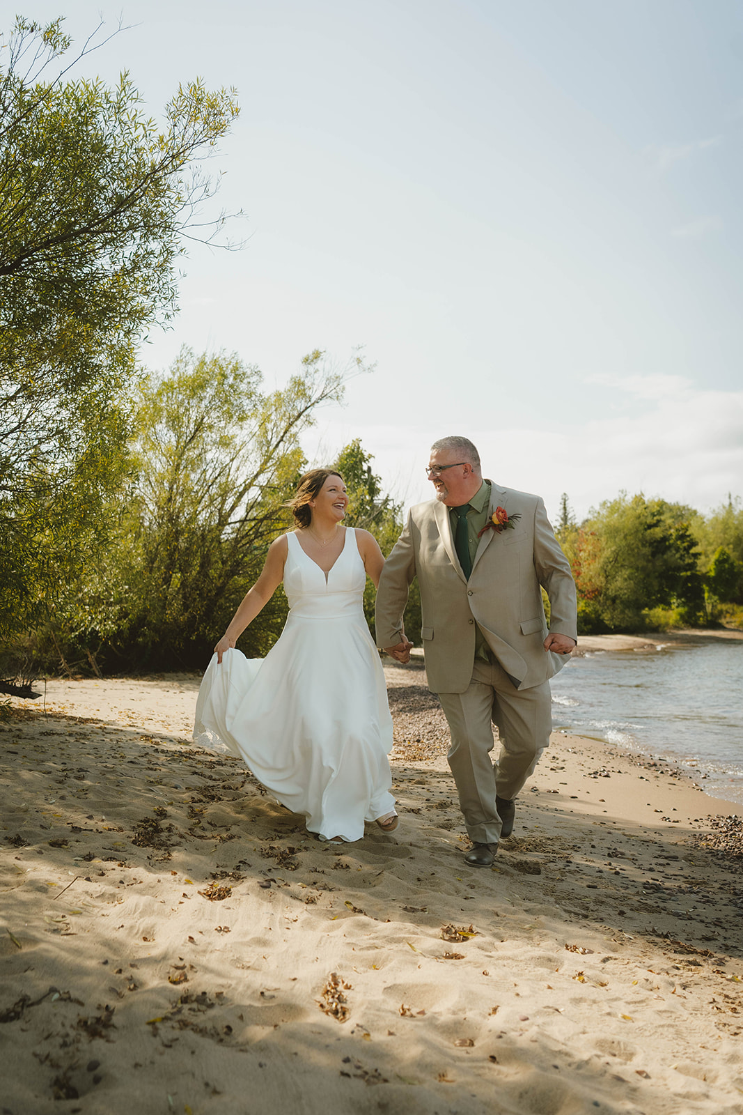 documentary style photos of the bride and groom from their dreamy wedding day at Copper Harbor
