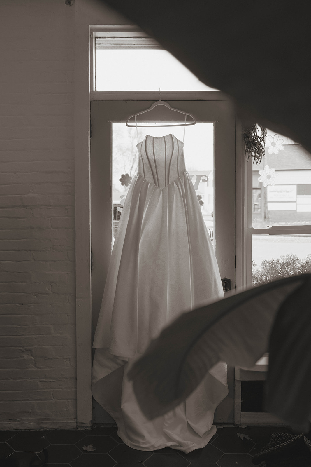 beautiful dress hangs ready for the big day