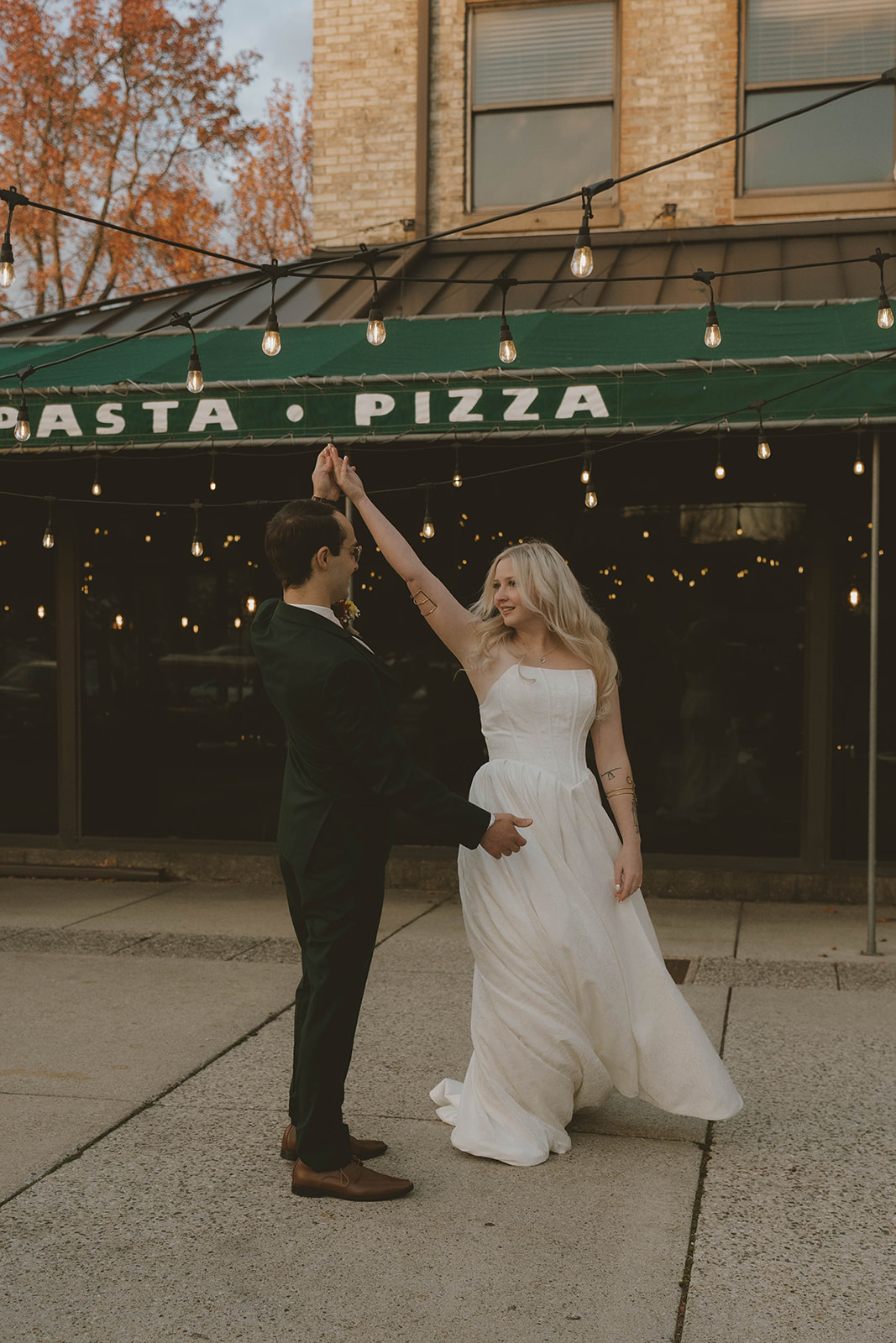 bride and groom dance during their outdoor wedding