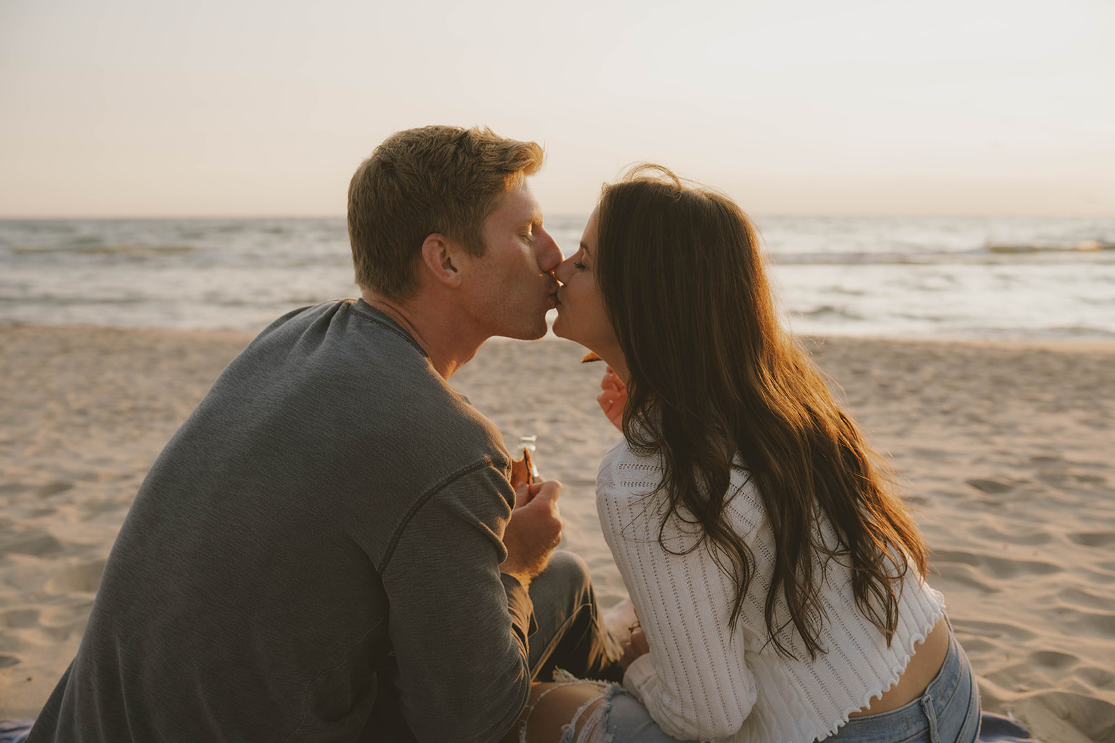 sweet kiss shared on the Lake Michigan beach