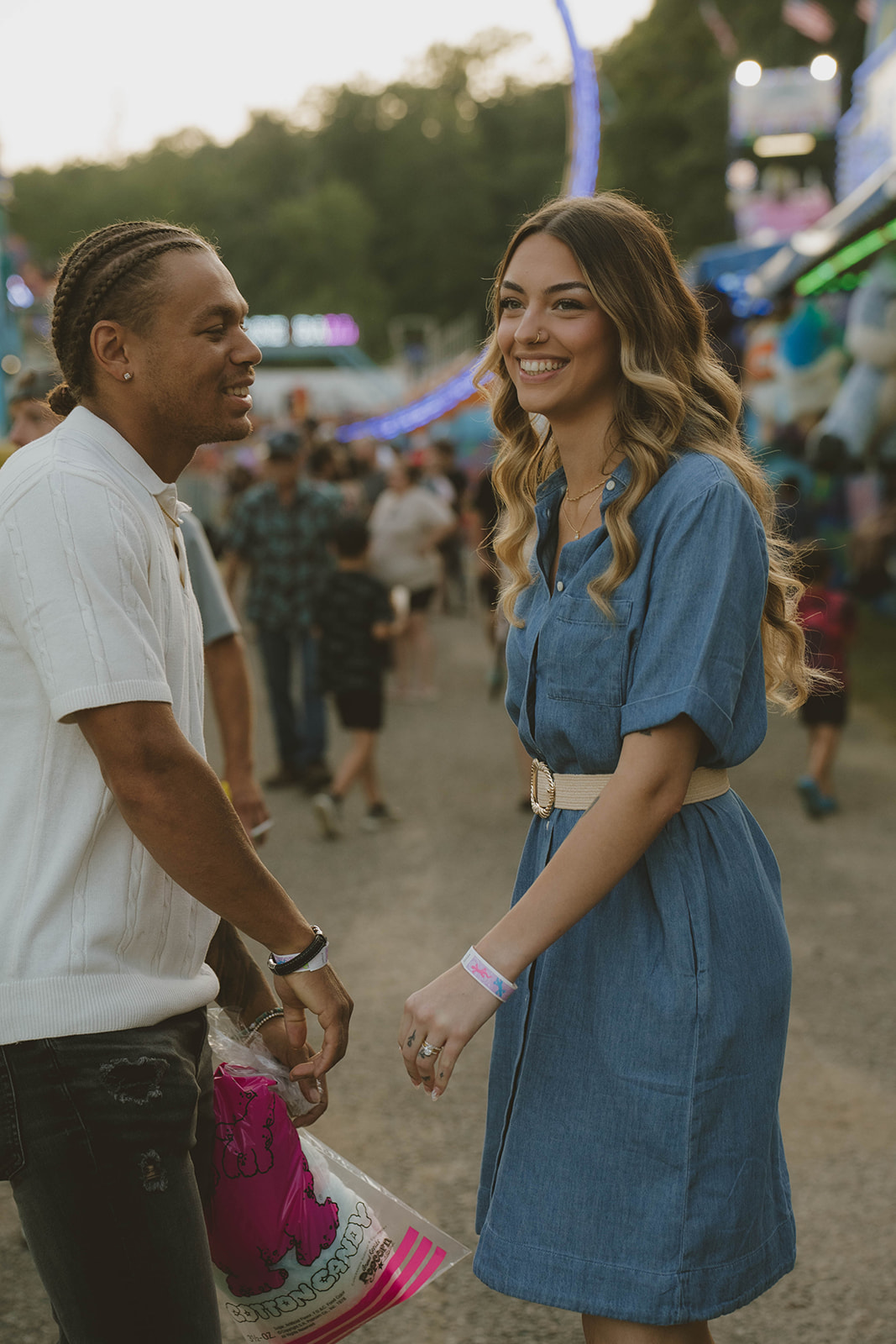 couple share laughter as they enjoy their fun couples photos at the state fair