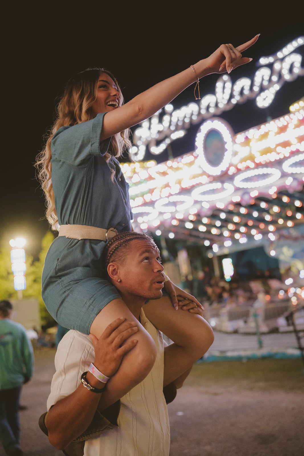 couple share laughs as they explore the state fair during their unique couples photoshoot!