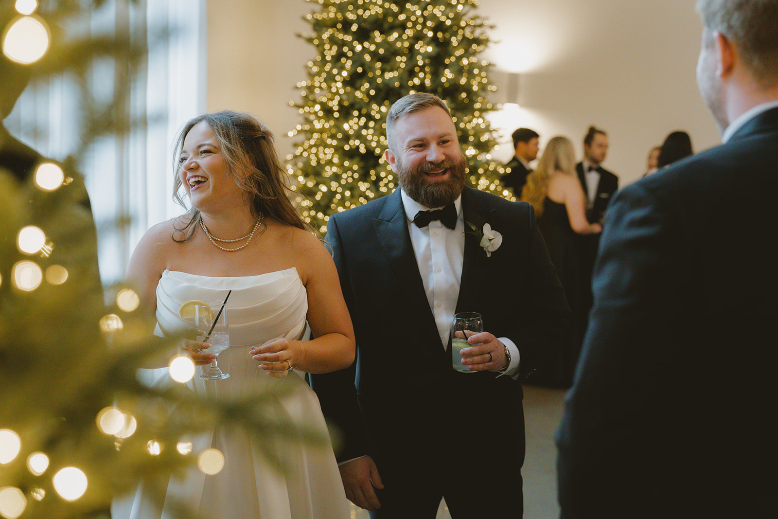 bride and groom laugh and share good times with their guests during their beautiful wedding reception