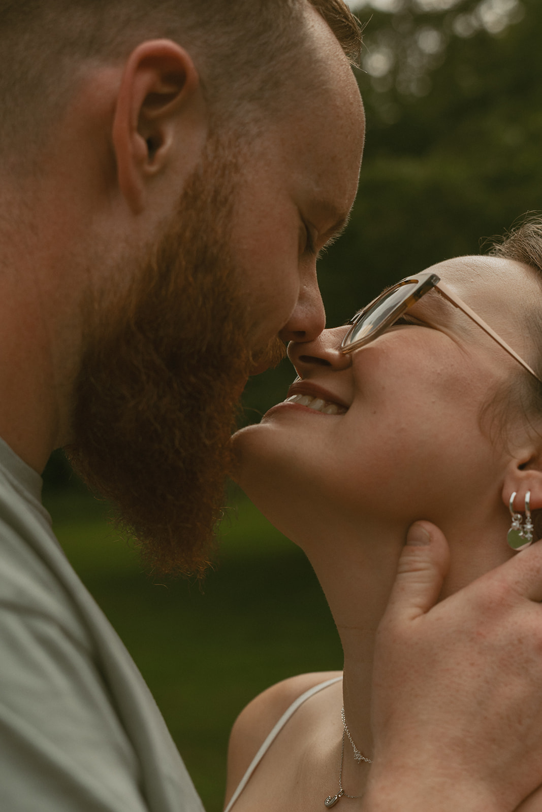 beautiful couple share intimate moments of love during their dow gardens engagement photos 