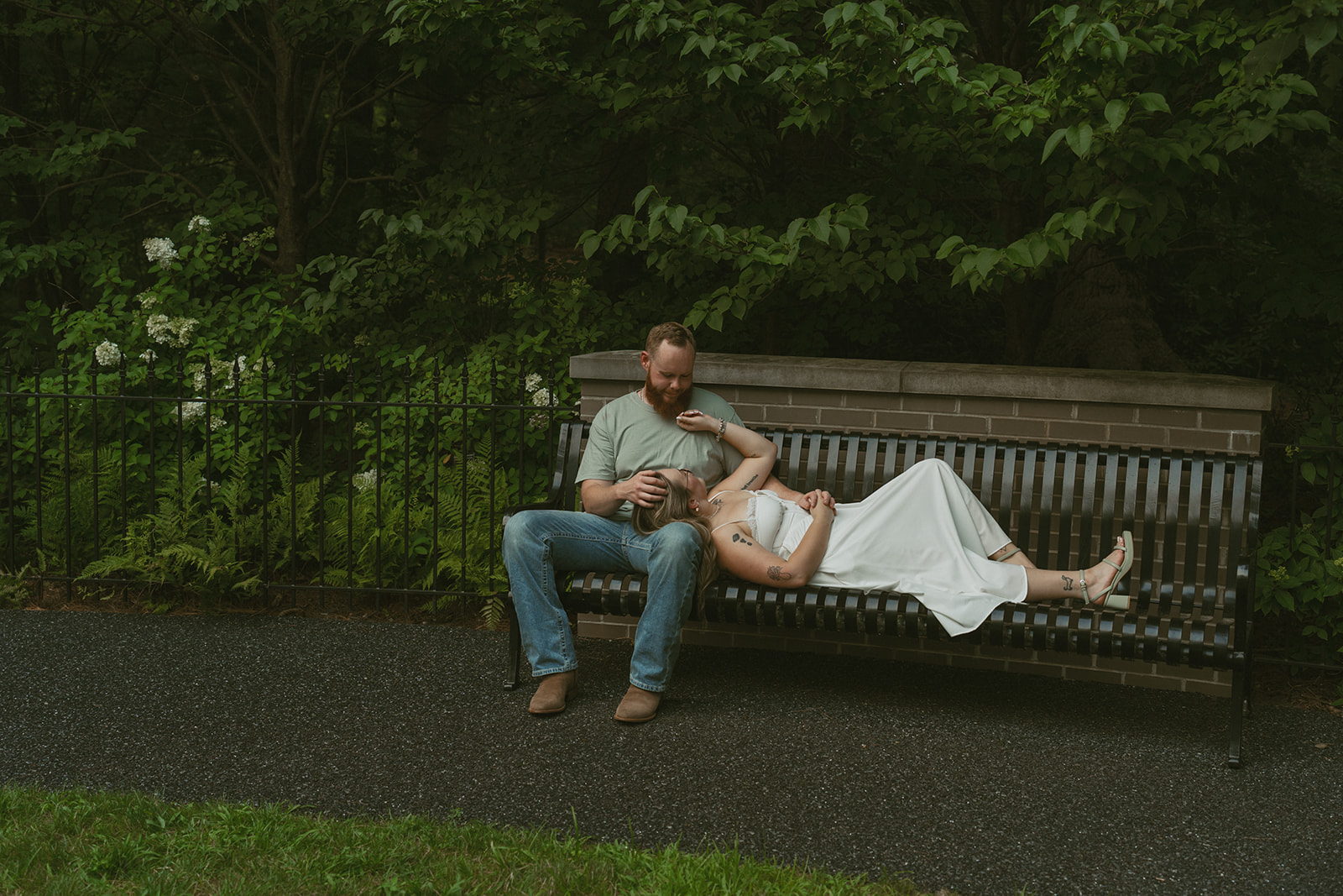couple lay on the bench together