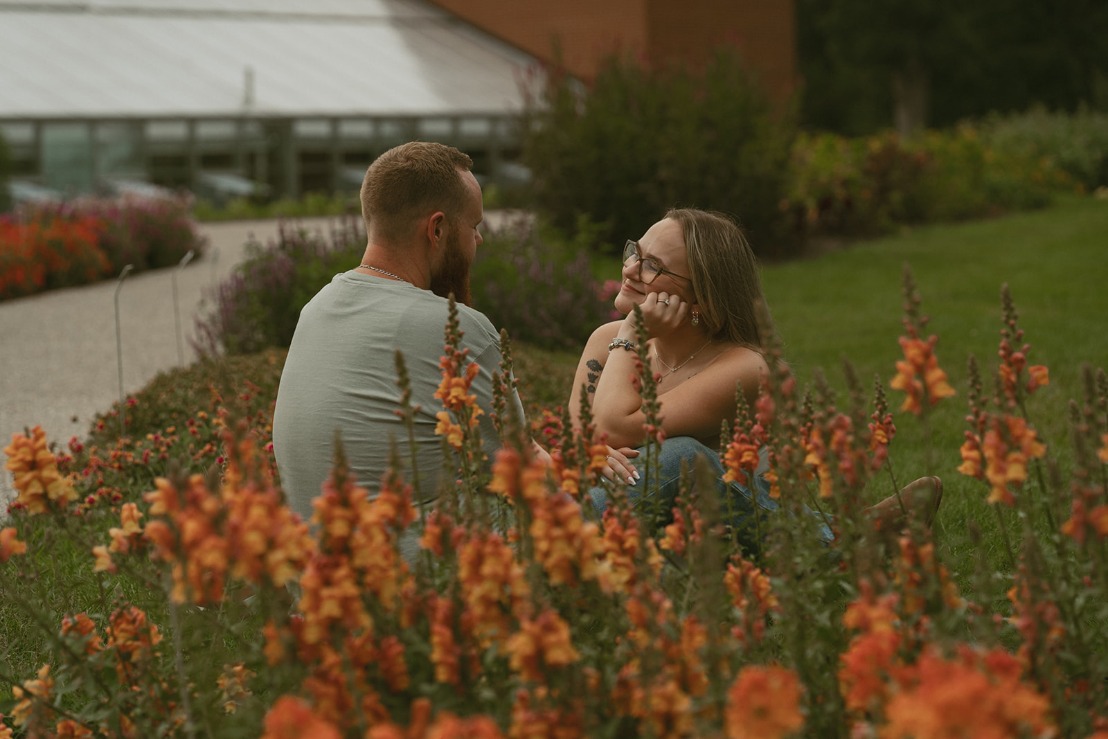 stunning couple pose together during their dow gardens engagement photos